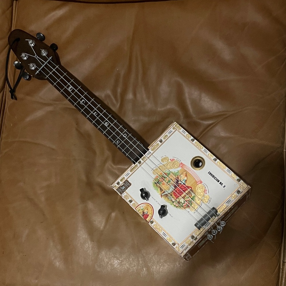 Unique Cigar Box Guitar with Colorful Design
